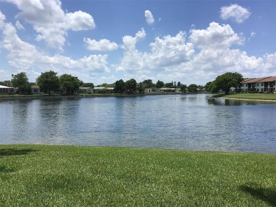 FABULOUS LAKE VIEWS WITH THIS FIRST FLOOR 2 BEDROOM 2 BATH CONDO. ALL AGES WELCOME! UPGRADED KITCHEN WITH GRANITE COUNTER TOPS . LARGE OPEN PASS THRU FROM KITCHEN TO DINING ROOM. UPDATED BATHROOMS.  WASHER AND DRYER IN UNIT. TILED LIVING AREAS AND CARPET IN BEDROOMS. TILED PATIO. NO CREDIT SCORE OR INCOME REQUIREMENTS BY THE ASSOCIATION. NO PETS. GREAT COMMUNITY!
