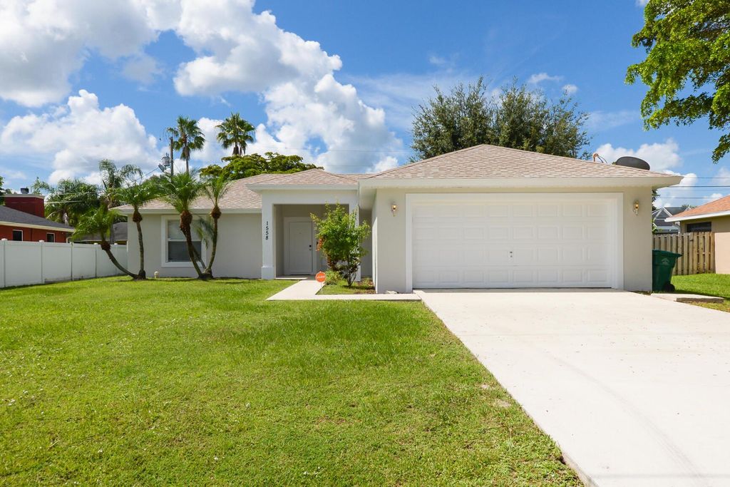 Photo of 1558 SW Mullinax Avenue, Port St Lucie, FL 34953 (MLS # R10902054)