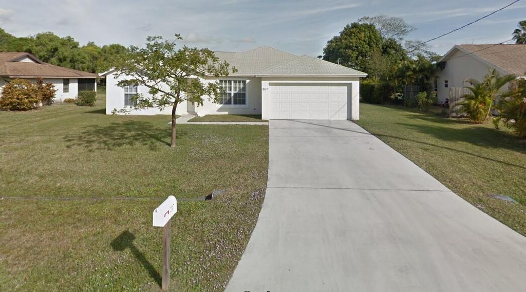 Photo of 2117 SE Dolphin Road, Port St Lucie, FL 34952 (MLS # R10934127)