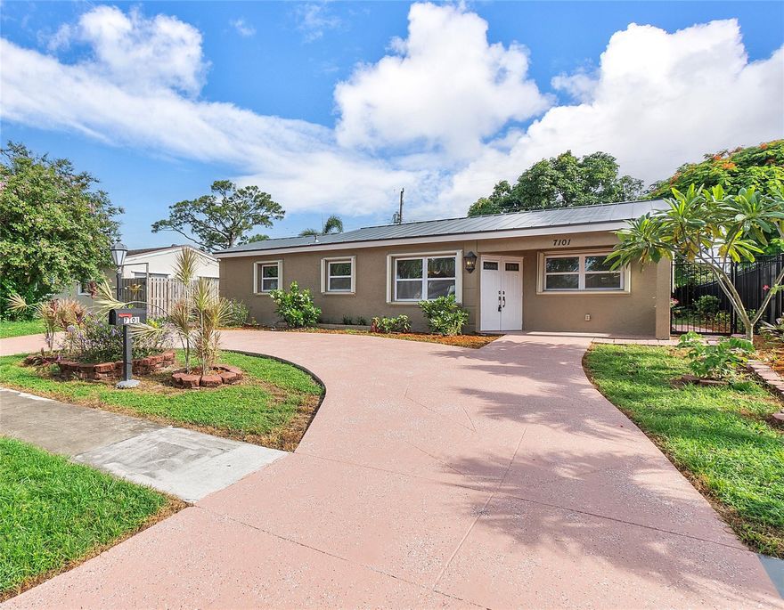 Beautifully updated 3/2 single-family house in Hollywood.This house has been totally remolded with granite and marble countertops in the kitchen and bathrooms. Open floor plan with porcelain tile floors throughout.  Newer metal roof. Impact windows plus accordion storm shutters. The huge backyard has been totally fenced in on a large lot with gates on both sides. Newer circular driveway,  huge back patio, and large storage shed in the back yard. Beautiful landscaping. All newly updated appliances, New A/C, including the washer and dryer. Tankless water heater.  Newer septic system. Great location close to I-95. A must-see!