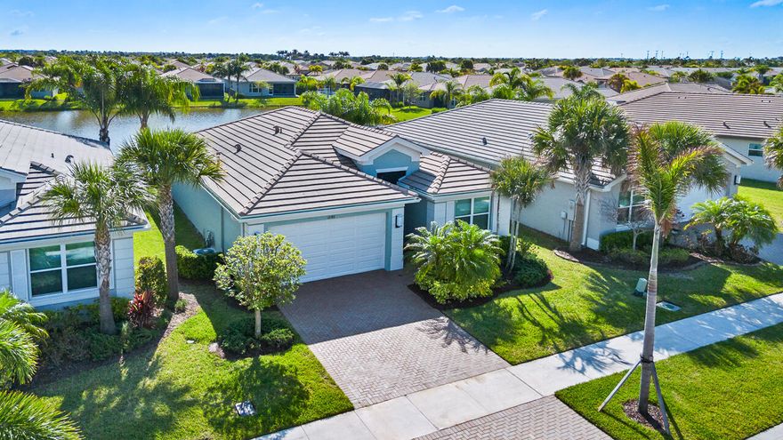 Welcome to Little House on the Lake, your peaceful retreat in Valencia Cay—a vibrant 55+ community with resort-style amenities and an active social scene. This charming east-facing home offers serene lakefront views and has been meticulously maintained, featuring freshly painted interiors and exteriors, luxury vinyl plank flooring throughout (no carpet!), and a recently sealed driveway. The fenced backyard is perfect for pets, while the location puts you near the Cleveland Clinic, shopping, and fine dining. Discover the perfect blend of comfort, convenience, and community here!