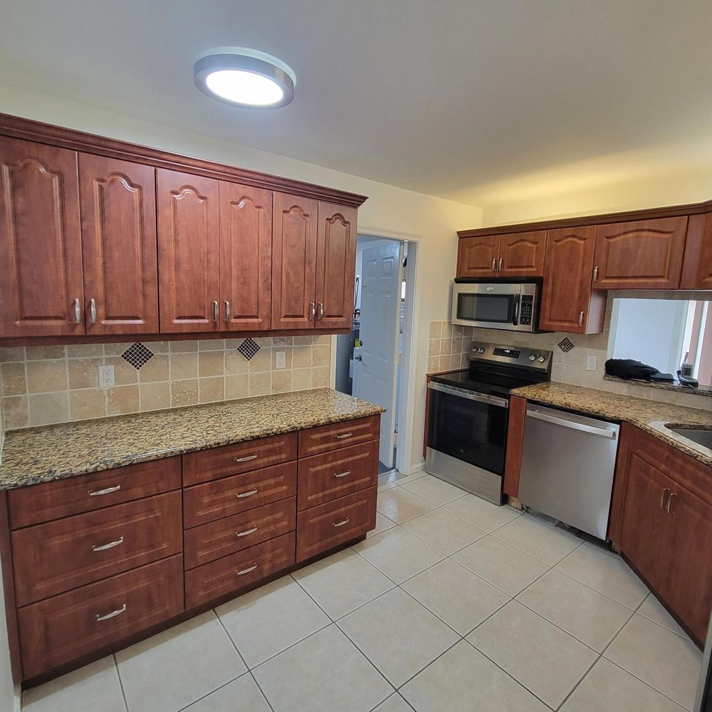 Photo of 23 Via De Casas Sur #103, Boynton Beach, FL 33426 (MLS # R11157062)