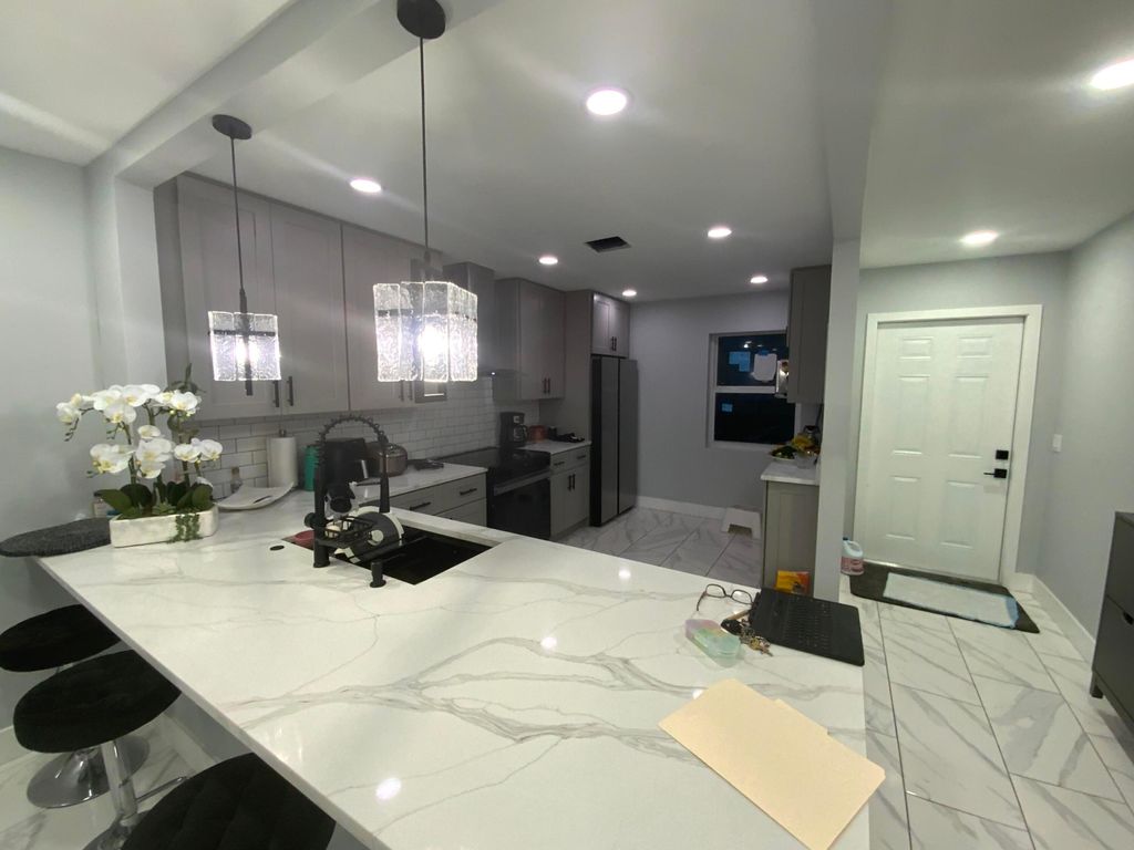 Photo of 5730 E Fernley Drive E #12, West Palm Beach, FL 33415 (MLS # R11161073)