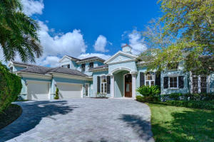 This two story golf course residence was built in 2005 by Qualk Homes. Features include a foyer entry, formal living/dining room, custom moldings and trim, volume ceilings, wood flooring, private den/library, first floor master suite with his/her baths and walk-in closets, wet bar, fireplace, gourmet kitchen with wood cabinetry and granite countertops, impact windows and doors, 2nd floor loft area, home generator and natural gas. Open pool/patio area with lush tropical landscaping and views of the 1st fairway. Three car plus golf cart garage with front circular driveway.