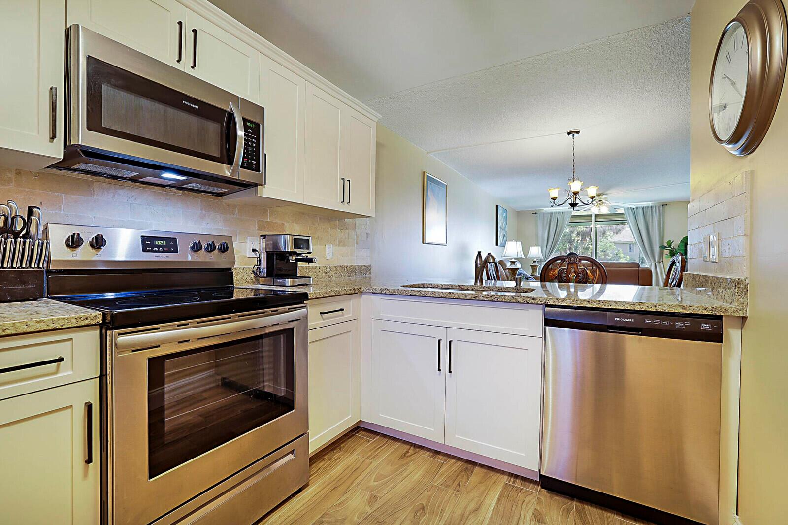 Welcome home to this beautifully updated 2-bedroom, 2-bathroom condo, where comfort meets style in one of the area's most desirable 55+ communities. From the moment you step inside, you'll be wowed by the fresh, modern upgrades and serene garden views that make this home truly special. Enjoy the peace of mind that comes with a complete renovation -- including brand new appliances, cabinetry, countertops, tile flooring throughout, updated bathrooms, fresh paint, and custom window treatments. Every detail has been thoughtfully designed with both elegance and ease of living in mind. The floor plan offers two generously sized bedrooms, each with spacious walk-in closets, ideal for storage and comfort. The light-filled living area flows effortlessly into the dining space and kitchen, creating