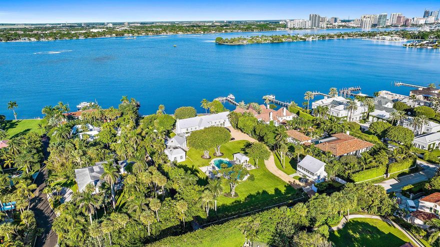 854 S County Rd offers a very rare opportunity to acquire a large 2+ acre lakefront property close to the heart of Palm Beach.  Designed by beloved architect, Howard Major, this exceptional compound offers a beautifully located property on the Intracoastal Waterway in Palm Beach's grand Estate Section.  Affording a desirable & lengthy entry processional, ample privacy, infrequently available green space for a well-located tennis court & pavilion, & the close proximity of nearby Worth Avenue's shopping, galleries & restaurants.
