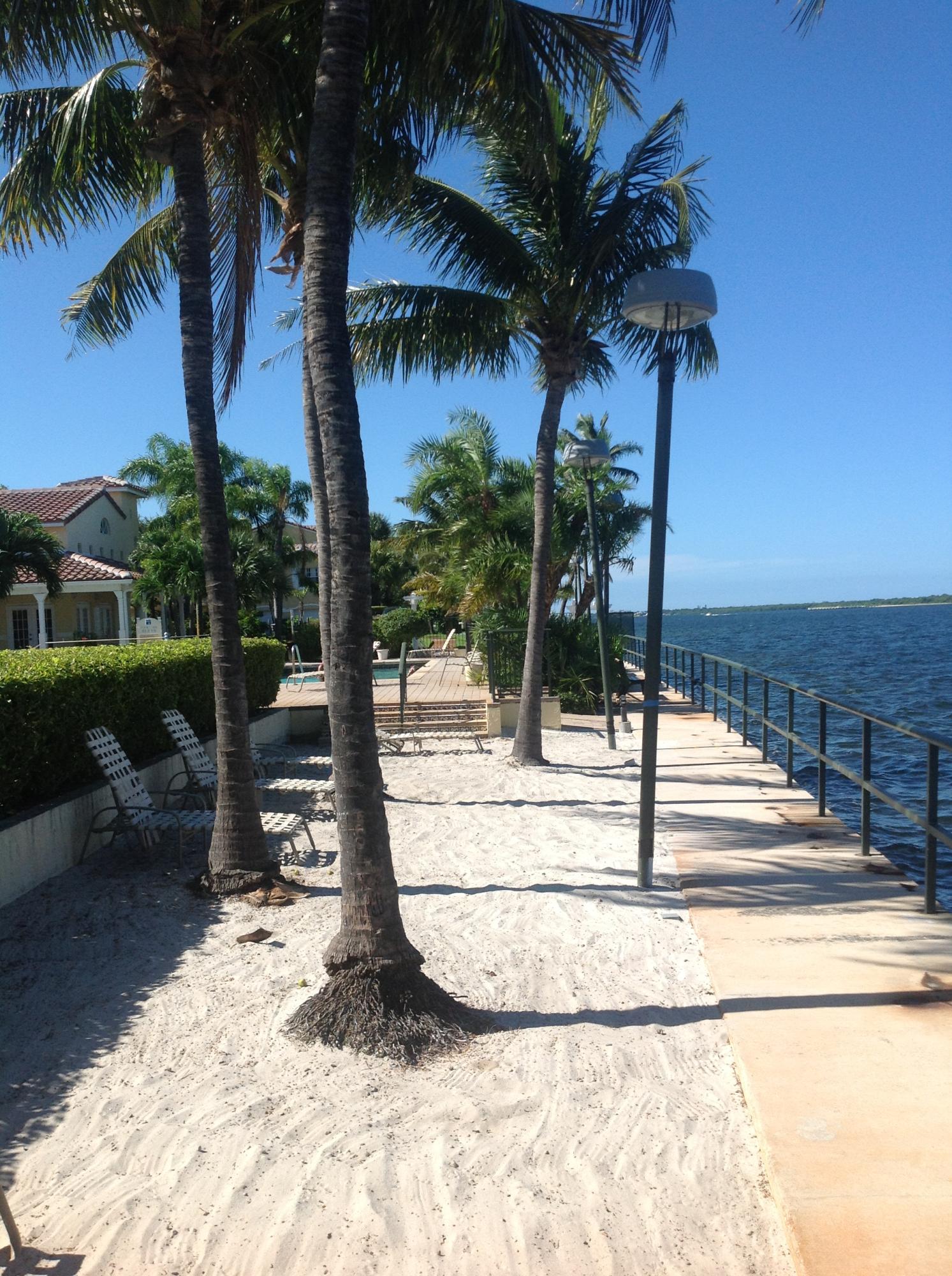 Condo that lives like a town home with a garage. 2 Bedroom, 2 Bath unit is situated in the desirable Bay Reach Community. Bay Reach is a charming Intracoastal community boasting a pool, clubhouse, and gym, all conveniently located along the Intracoastal waterway. A sandy beach area at the seawall welcomes residents and guests, equipped with beach chairs and several grills for enjoyable afternoon or evening gatherings. Pets allowed on a case by case situation. 35 lb weight limit per HOA
