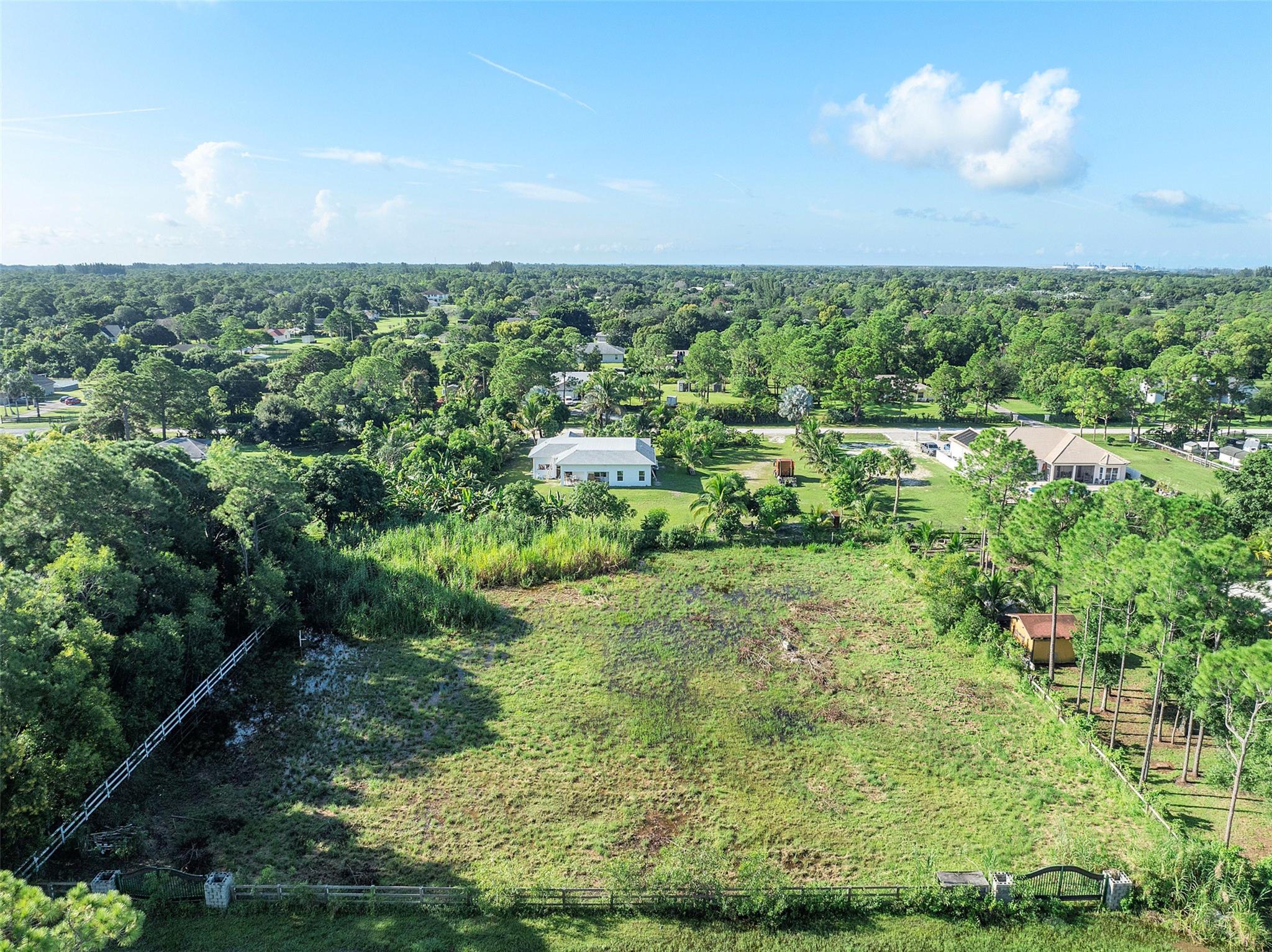 Time for a change? Here's your chance! Come and see this 1.15 acre piece of freedom. This prime land in the Acreage is waiting for you to plan your custom built Dream Home! This land is cleared of trees, fenced and ready for your ideas. Bring your Family, Business, Boats, RV's, Horses etc. This area is unincorporated "NO HOA" so you are free to stretch out and enjoy your property. Located near plenty of shopping, dinning, entertainment and more. Close to major highways and roadways but not too close, enjoy the natural sounds of this beautiful area! This area just keeps getting better and better, popular stores are breaking ground regularly making your everyday needs super convenient. Come and be a part of this growing community in Palm Beach County Florida. Make an offer today.