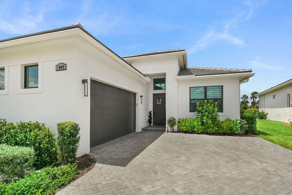 Photo of 9084 SW Arco Way, Port Saint Lucie, FL 34987 (MLS # B26019595)