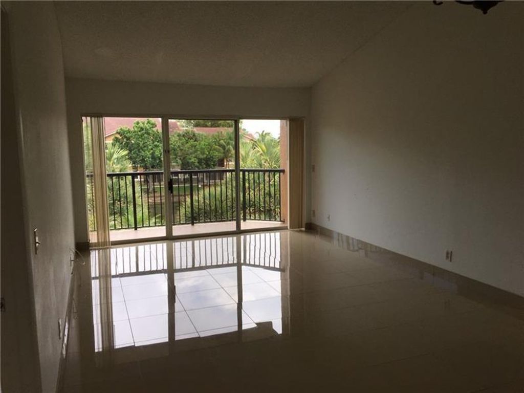 Photo of 8891 Wiles Road #304, Coral Springs, FL 33067 (MLS # F10529837)