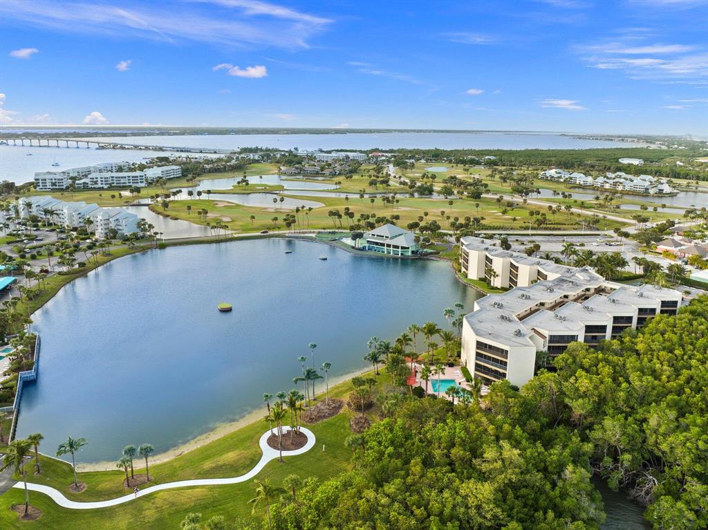 Fall in love the second you step foot in this turnkey fully furnished condo with beautiful sunsets overlooking the lake & Indian River. This spacious 2BR/2BA condo located in Plantation Club Villas at IRP has been completely updated with beautiful finishes. This condo features new cabinets, granite & SS appliances in the kitchen, wood look tile throughout, updated baths, BRAND NEW 2022 AC, newer washer/dryer, front impact windows with Plantation Shutters, & oversized screened in patio with panoramic views! One covered parking spot and sizeable, private storage room. Walking distance to the community pool, deeded beach access, and pro shop. HOA includes cable, internet, trash, water, fitness room, club/gathering room, heated pool, gas grill. Only a short distance to downtown,