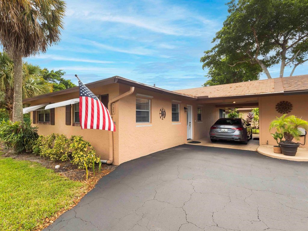 Photo of 725 Whippoorwill Lane, Delray Beach, FL 33445 (MLS # R11119411)
