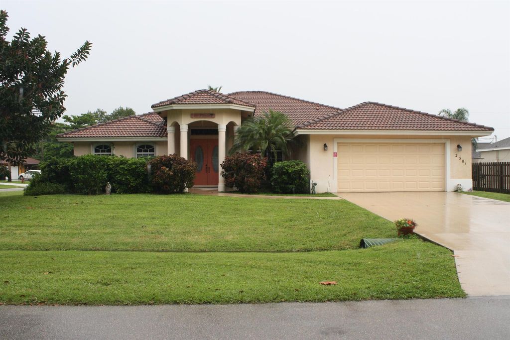 Photo of 2301 SW Lejune Street, Port St Lucie, FL 34953 (MLS # R10923732)