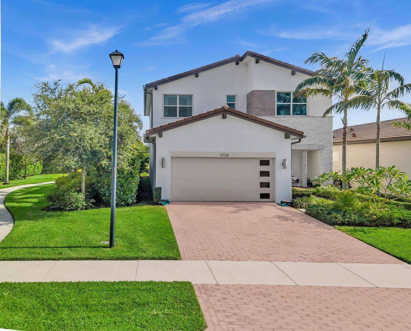 Welcome to one of the most private homes in the desirable Andalucia community. Nestled at the end of a quiet street, this home offers direct access to a serene, secluded green space right next door. Inside, soaring ceilings and an open floor plan lead to a lush backyard - ideal for relaxing or entertaining. This hurricane-proof smart home features impact windows, keyless entry, built-in sound system, a Ring doorbell, and an advanced 11.53 KW Tesla Solar System with two Powerwalls for energy efficiency and backup power.