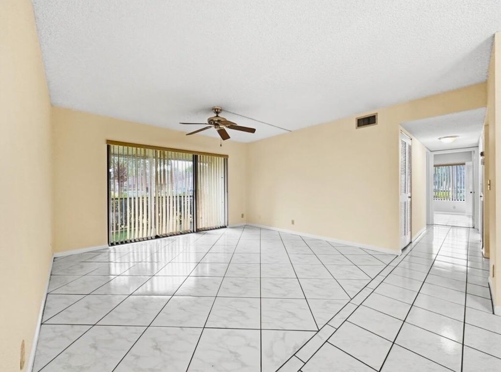 Photo of 708 Sunny Pine Way #A1, Greenacres, FL 33415 (MLS # R11162925)
