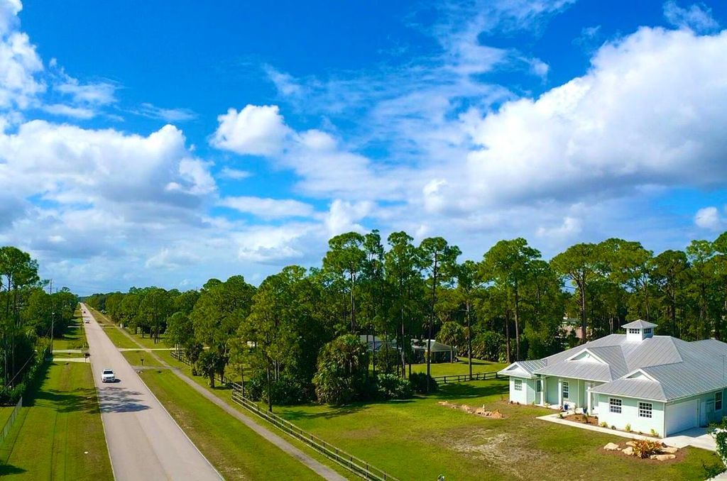 Photo of 14157 Key Lime Boulevard, Loxahatchee, FL 33470 (MLS # R10931406)