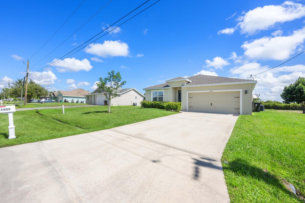 Photo of 1689 SW Hampshire Lane, Port Saint Lucie, FL 34953 (MLS # R10923696)