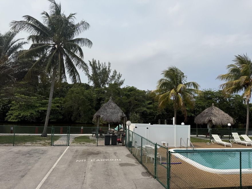 Updated 2-bedroom condo in a quiet community with pool, tiki hut, and grill. Enjoy watching boats pass by.  Water, sewer, and hot water are included, helping keep the electric bill low. Laundry facility conveniently located in the building. Great location close to Publix, airport, train station, I-95, and the Turnpike.