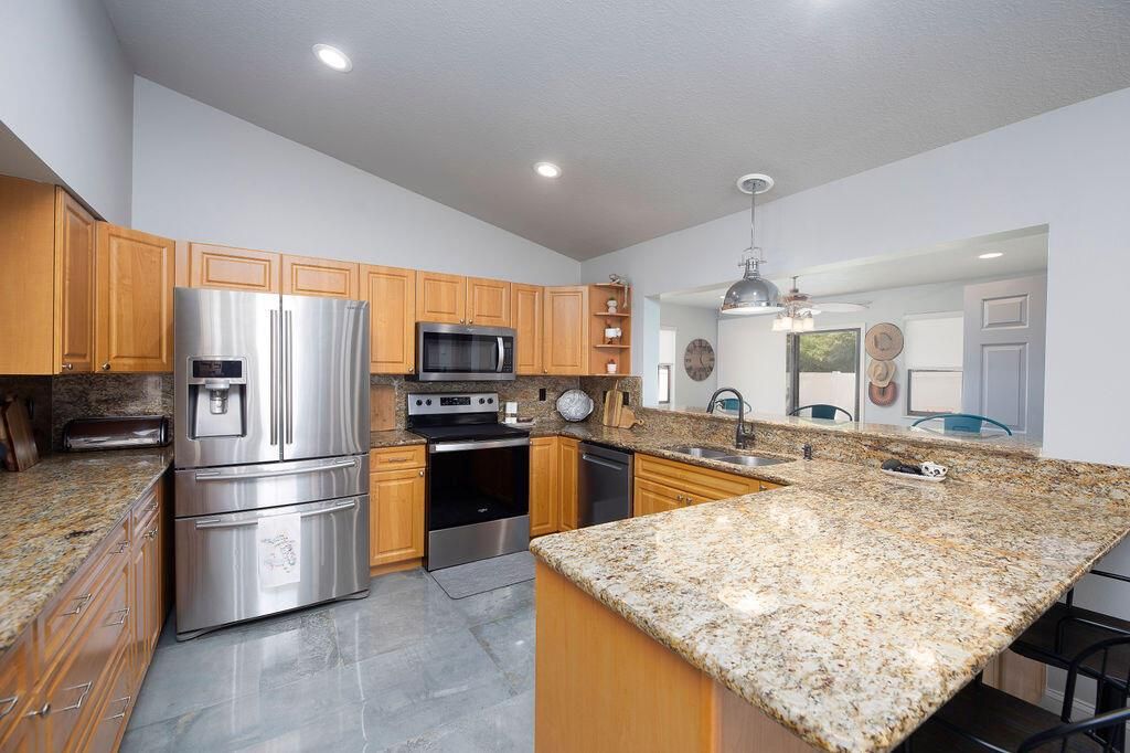 Photo of 801 NE Zebrina Senda, Jensen Beach, FL 34957 (MLS # R11097735)