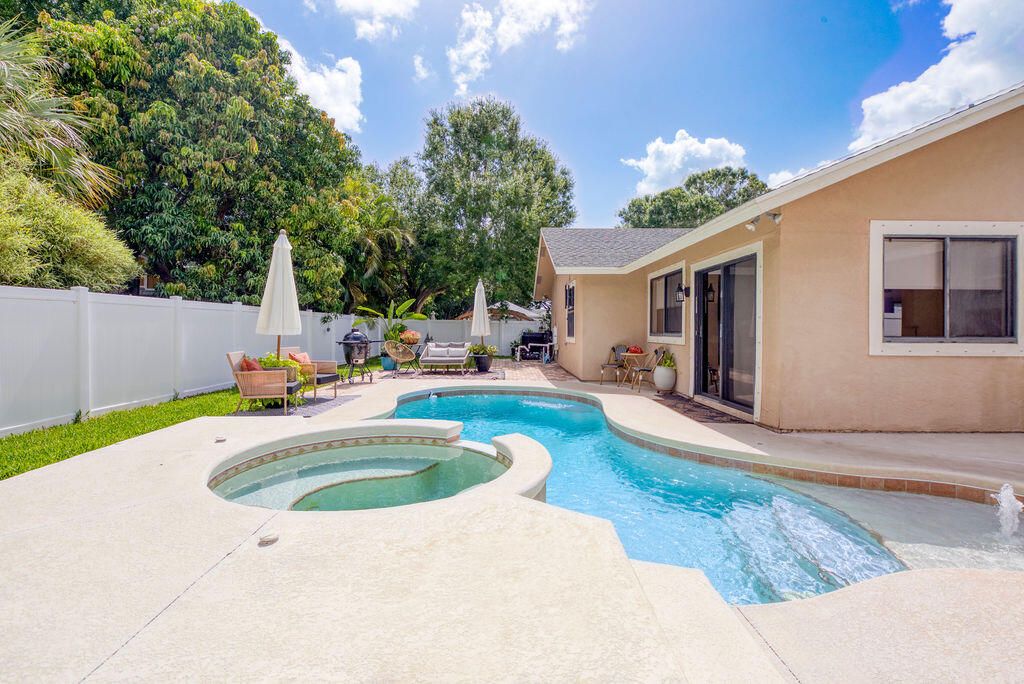 Photo of 801 NE Zebrina Senda, Jensen Beach, FL 34957 (MLS # R11097735)