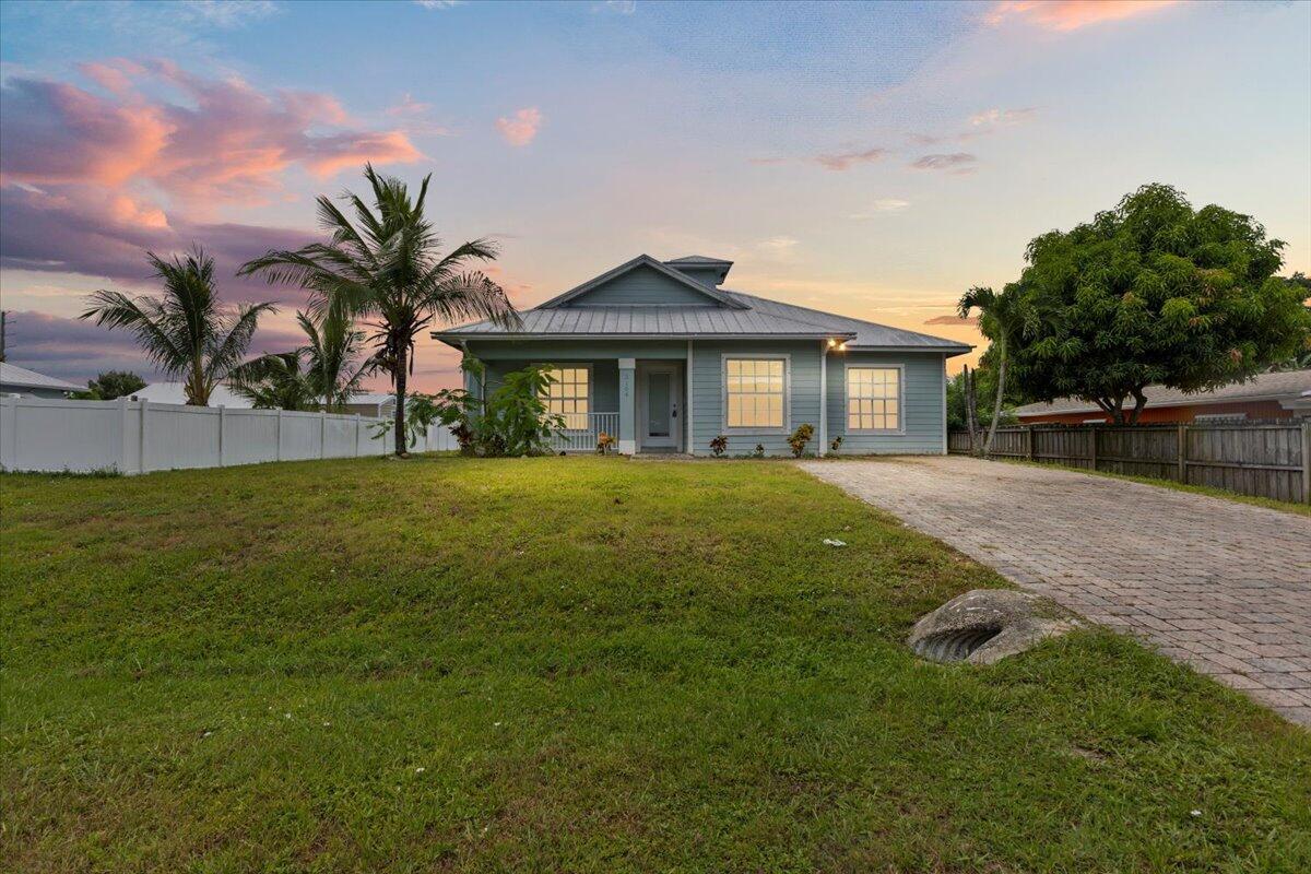 Discover your dream home in this adorable 4-bedroom, 3-full bath residence, ideally located near US1, just a stone's throw from shopping centers and beautiful beaches. Four cozy bedrooms providing ample space for family and guests, with three-well-appointed bathrooms, ensuring convenience and comfort. Enjoy the fresh, new flooring throughout the home, creating a warm and initing atmosphere. The open-concept kitchen is perfect for entertaining, featuring modern appliances and plenty of counter space for cooking enthusiasts. Ample outdoor area to customize as you desire! There's plenty of room for a pool, playground, or even a garden oasis, making it ideal for families and hosting gatherings. Schedule a tour today and imagine all the possibilities for fun and relaxation in your new backya