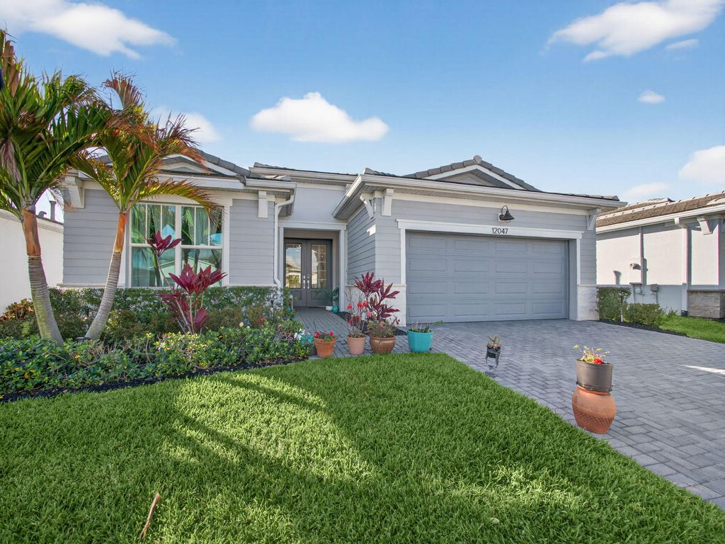Photo of 12047 SW Viridian Boulevard, Port Saint Lucie, FL 34987 (MLS # R11169695)