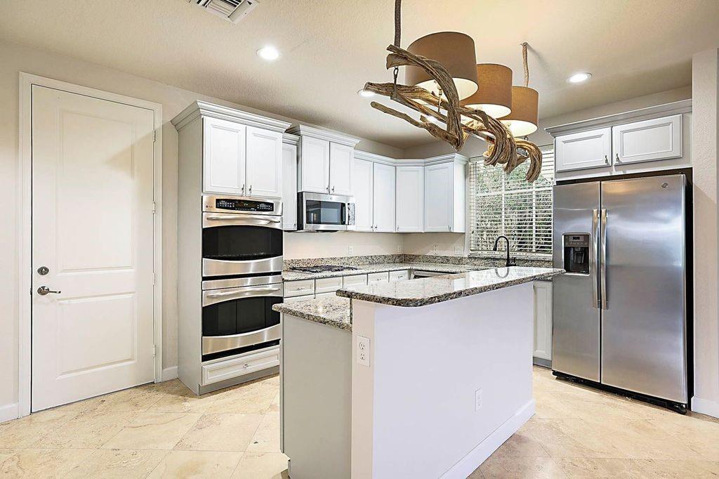 4 bed + Office & 2 Car Garage home over 2900 living sq ft. A+ School Zone. Prime East Boca location on corner lot in Library Commons. 1st floor features travertine flooring & room perfect for home office/ guest/in law. Over sized living/family/dining room with plenty of space for everyone. Kitchen with double oven, natural gas stove top & stainless appliances. Breakfast area + cooking island/bar top. Full size laundry room upstairs. Hurricane impact glass + double car garage. Huge dual walk in closets in primary. Covered patio and wrap yard. Community Pool. Located in sought after Downtown Boca Raton close to Brightline, Library, Mizner Park & beaches. Pets welcome. Super Low HOA. Motivated Sellers. Some photos virtually staged