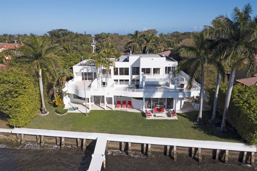 This is an incredible opportunity for someone to make this house there dream house, great for an end user willing to do some work. Interior features include a gourmet chef's kitchen with industrial appliances; phenomenal master suite with massage room and custom bath complete with sauna and expansive steam shower; formal dining room; separate den and beautiful light bathrooms. Exterior features include outdoor summer kitchen with two exterior dining areas; spectacular rooftop balconies providing extraordinary sunset and water views ideal for entertaining and relaxing; private pool; boat house on the water that could easily be converted into a fifth bedroom with full bath; and custom boat dock with lift to accommodate multiple watercrafts.