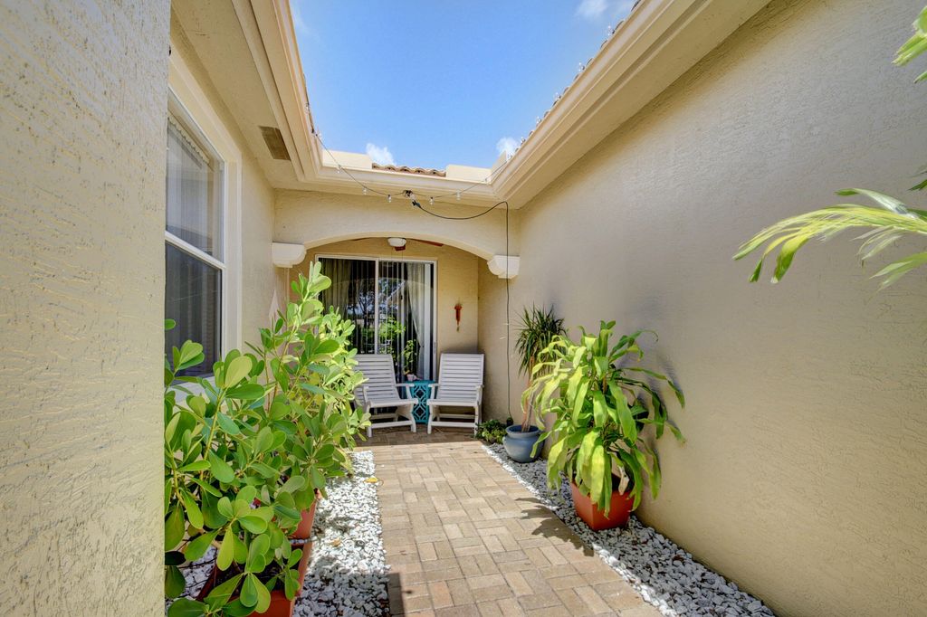 Photo of 2187 Umbrella Cay, West Palm Beach, FL 33411 (MLS # R10951718)