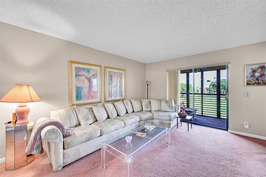 Location, Location, Location, in this 2 bedrooms and 2 baths condo right across from Clubhouse with screened in patio and lovely views of the lake and golf course! A 55+ community!  Good condition owners are Snow Birds!  Phase 4 building has a newer roof, pool, tennis, golf, dancing, shows, theater and so much more!  Close to restaurants and shopping too.  No showings after 6 pm.