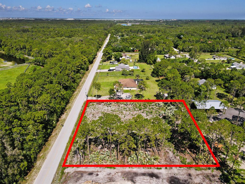Looking to build your dream home. Look no further then this 1.14 acre vacant lot cleared and ready for building. Soil test was done last year and is available upon request. It's high and dry with no pond. Surrounded by natural vegetation and tall pines! Prime location on a paved road within easy access to amenities, Seminole Pratt Whitney Rd and Okeechobee Blvd. Don't settle for a pre-build home. that doesn't meet your needs. Come home to peace and quiet in the heart of the Palm Beaches.