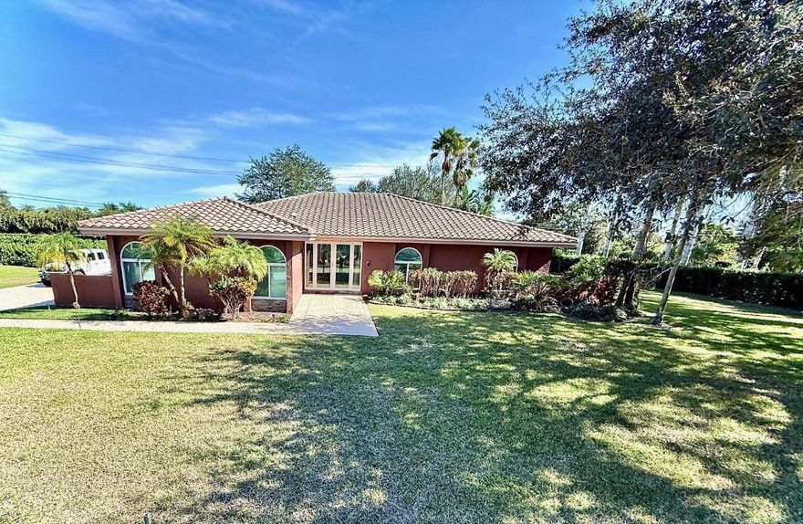 Nestled within a picturesque, oak-lined community of custom-built homes, this spacious 4 bed, 3.5 bath corner pool home sits on a builder’s acre and offers the perfect blend of comfort and charm. The open floor plan is ideal for both everyday living & entertaining. Notable features include impact windows & doors and garage, vaulted ceilings, dual A/C systems, LED lighting, and surround sound both inside & out. The updated kitchen showcases quartz countertops, new KitchenAid appliances, and a pantry with coffee bar. Primary bathroom has been tastefully updated, including a soaking tub. Additional highlights include a wet bar entertainment area, Ring camera/alarm, Rachio smart sprinkler,  pool waterfall, covered patio with cabana bath and a private backyard.