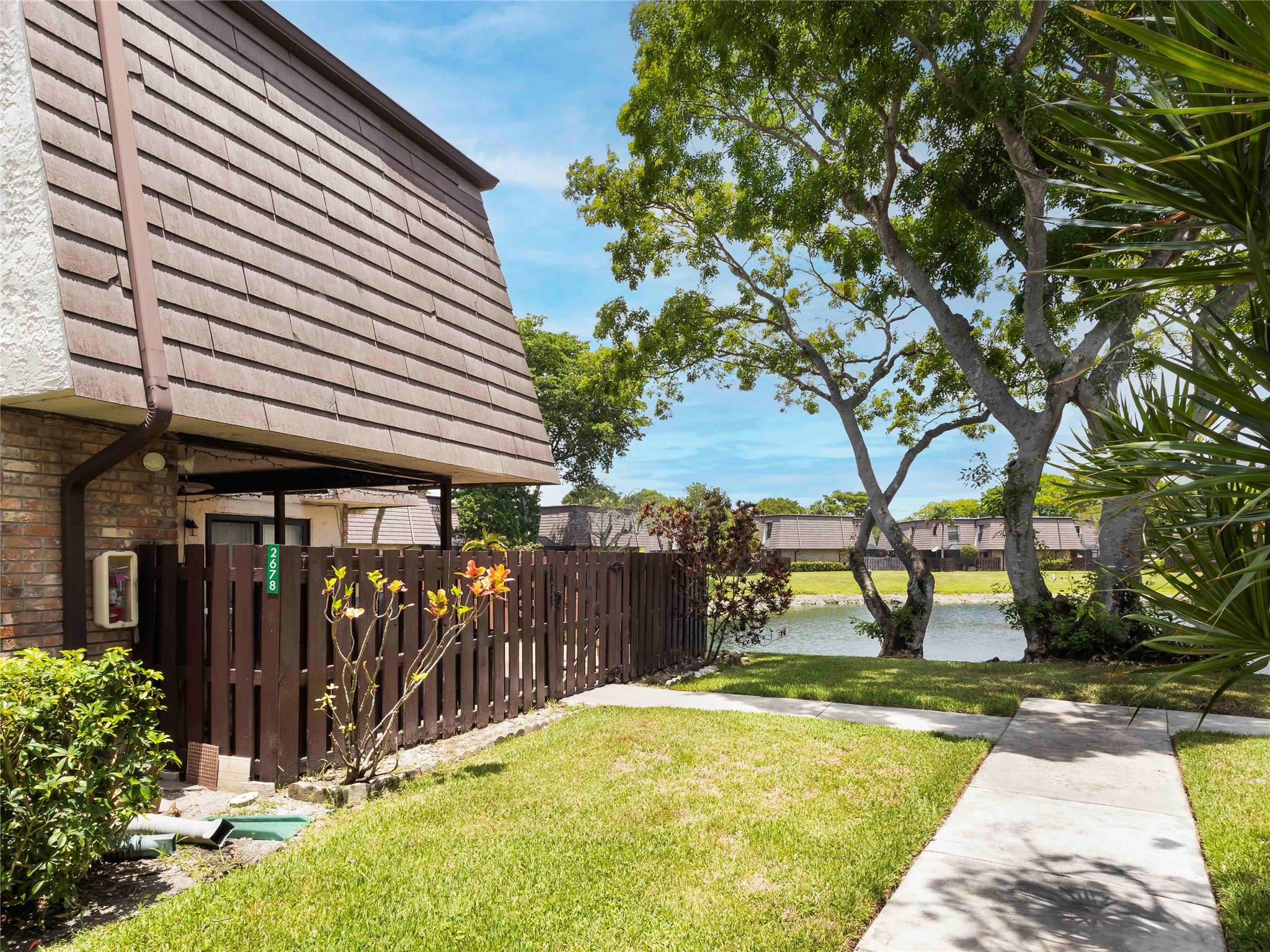 Beautifully updated 3BR/2.5BA townhome in Parkside, a highly desirable Coral Springs community with tranquil lake and park views. This home features an open kitchen, new flooring on the stairs and second floor, a remodeled master bathroom, and hurricane impact windows and doors. Enjoy the privacy of a fenced courtyard—perfect for outdoor living and entertaining. Ideally located within walking distance to Mullins Park, Coral Springs Center for the Arts, hospital, Saint Andrew Church, and The Walk. Zoned for top-rated schools. Don’t miss out—schedule your tour today!