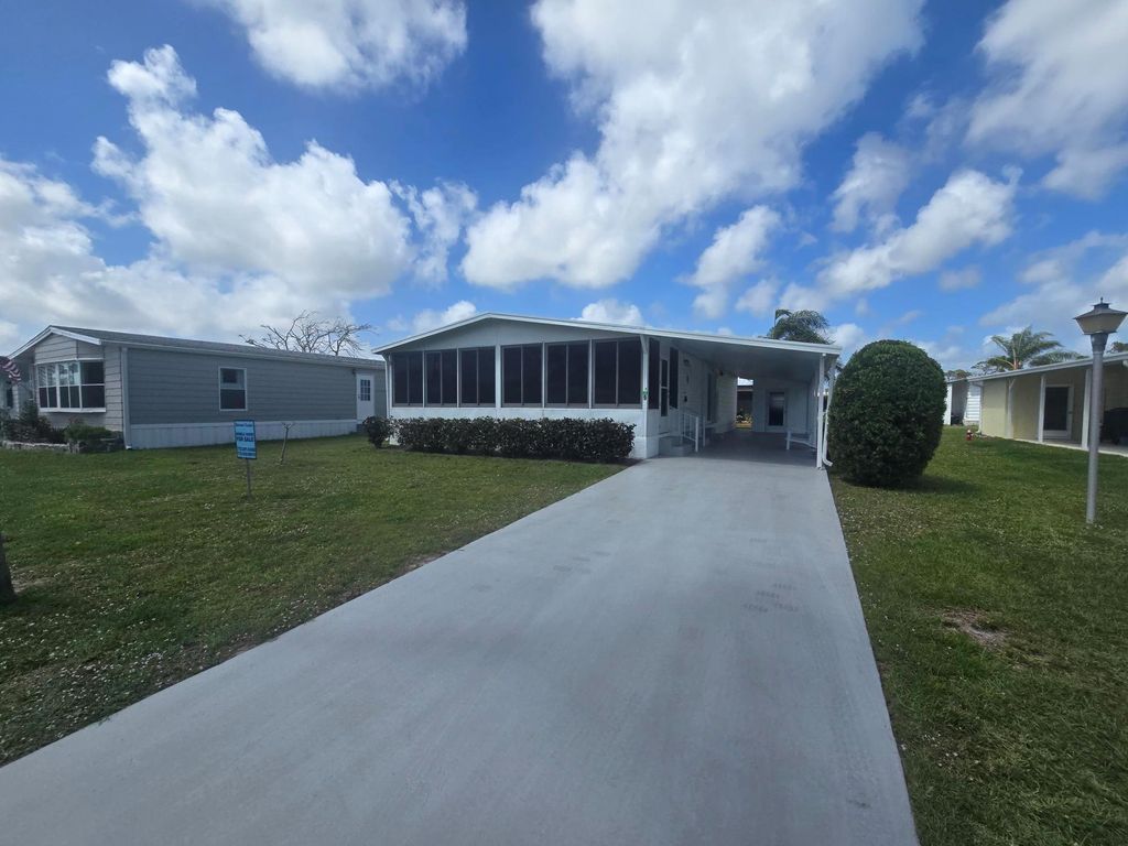 Photo of 9 Flores Del Norte, Fort Pierce, FL 34951 (MLS # R11044914)