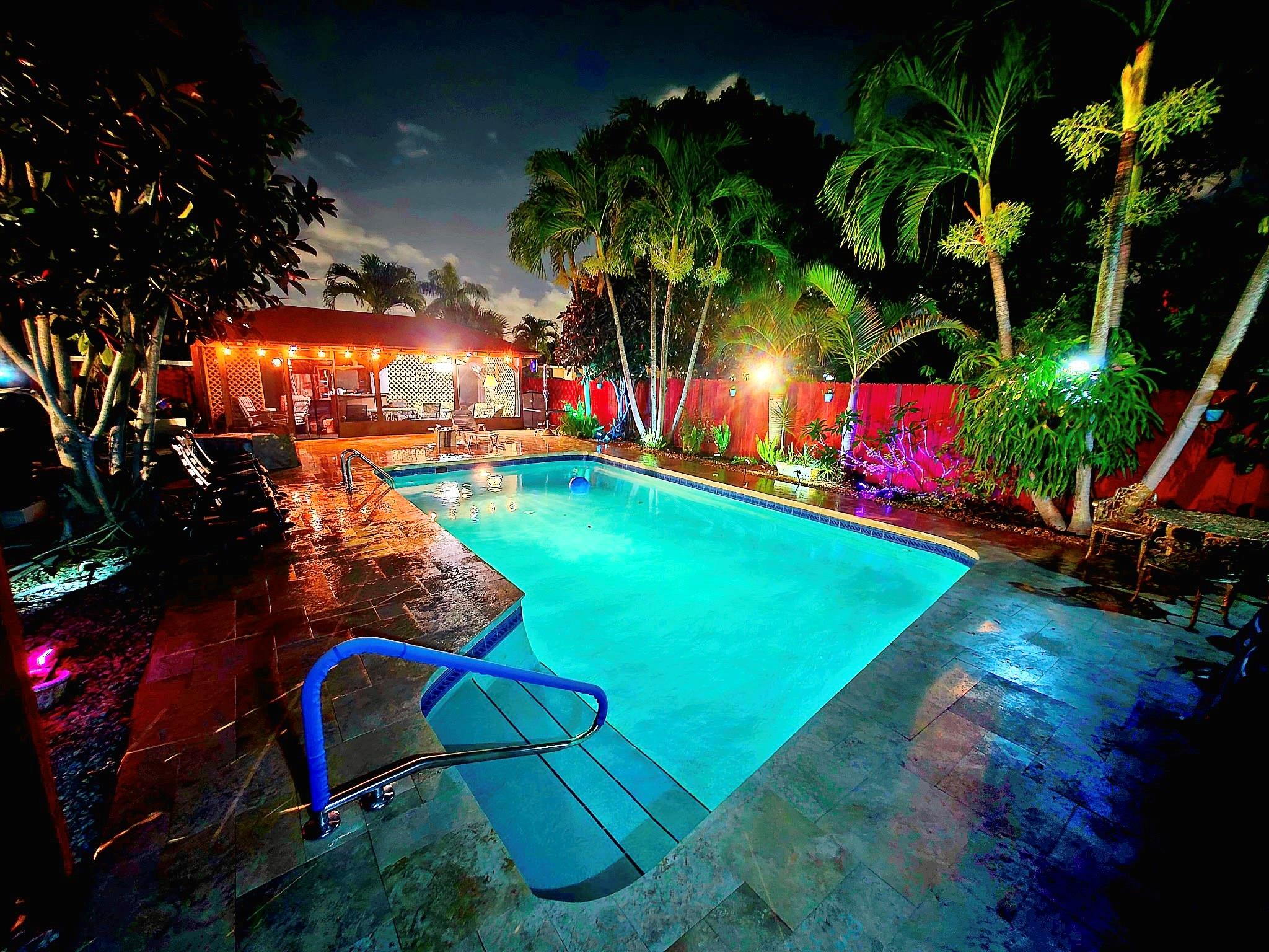 THE ONLY 4-PLEX AVAILABLE IN HOLLYWOOD WITH A POOL! Time to escape NEW YORK? Relax in your own Tropical Oasis COMPOUND on an oversized 27K sqft lot with 5,293 sqft of interior space plus a 24×40 garage & 12×24 cabana. Features a resort-style pool, with new travertine pavers, 6 foot privacy fence, outdoor shower, bar, and sound system. Property functions as two separate duplexes for added privacy. Units 1, 3 & 4 have mini-split ACs for amazing energy efficiency. 3 units are currently rented. New roof on units 3 & 4. 12 parking spaces, 2 driveways, lush landscaping, & tiled floors throughout. Minutes from Hard Rock, airport, beaches & more. Perfect for investors looking for strong returns, this property has the potential for $150K in revenue a year, based on annual rents.