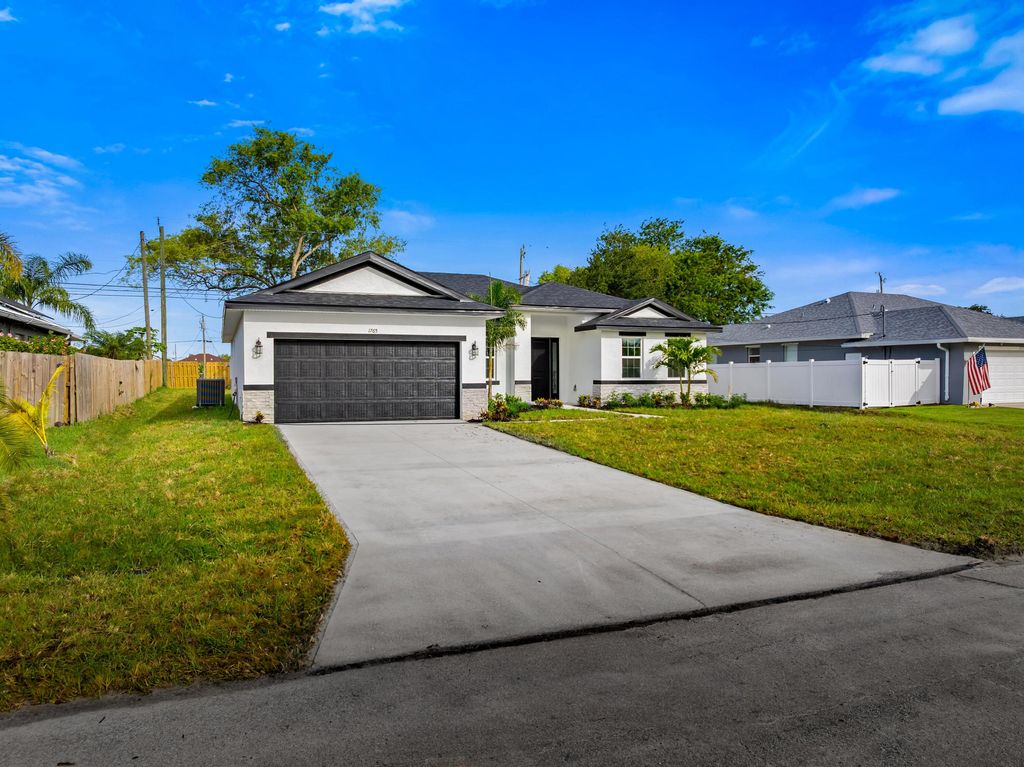 Photo of 1116 SW London Lane, Port Saint Lucie, FL 34953 (MLS # B26013036)