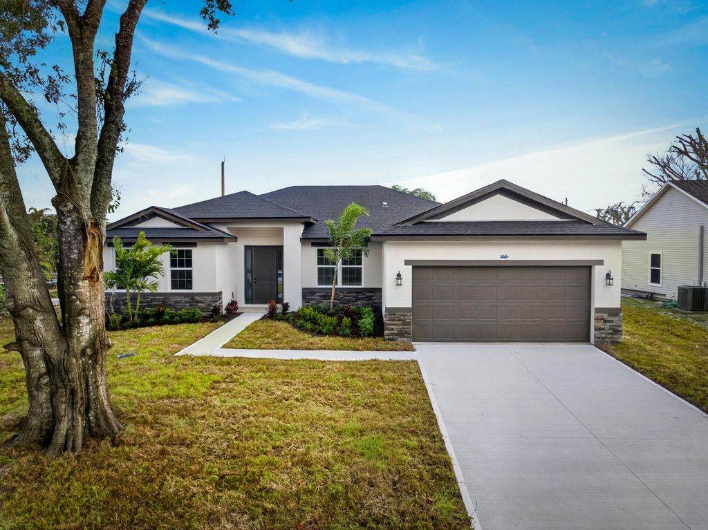Photo of 1116 SW London Lane, Port Saint Lucie, FL 34953 (MLS # B26013036)