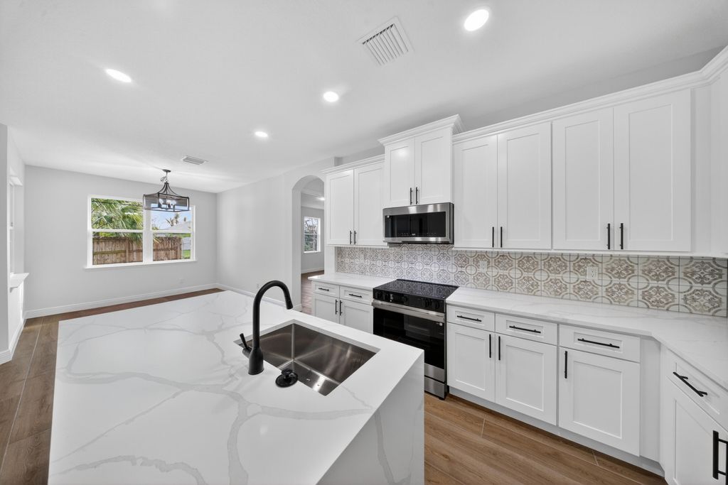 Photo of 1116 SW London Lane, Port Saint Lucie, FL 34953 (MLS # B26013036)