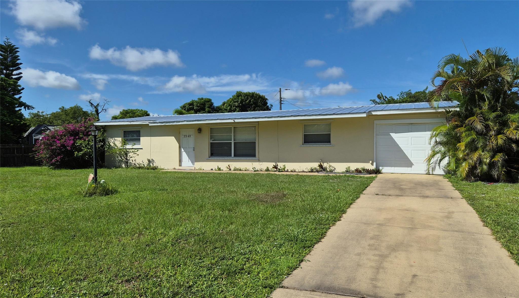Spacious 4-Bedroom Home with New Metal Roof on Large Lot! This well-sized 4-bedroom, 2-bathroom home offers incredible potential for the right buyer. Set on a generous lot with a huge backyard, there’s plenty of room to add a pool, patio, or create your own outdoor retreat. The home features a brand-new metal roof for lasting durability & peace of mind. Inside, the layout includes a good-sized laundry room & a large utility/storage area—washer & dryer included, as well as a 1-car garage for added convenience. The interior needs updating, making it a great opportunity to renovate & add your personal touch. Whether you're looking for a family home to customize or a solid investment property, this home offers space, functionality, & serious potential. Seller may help with closing costs.