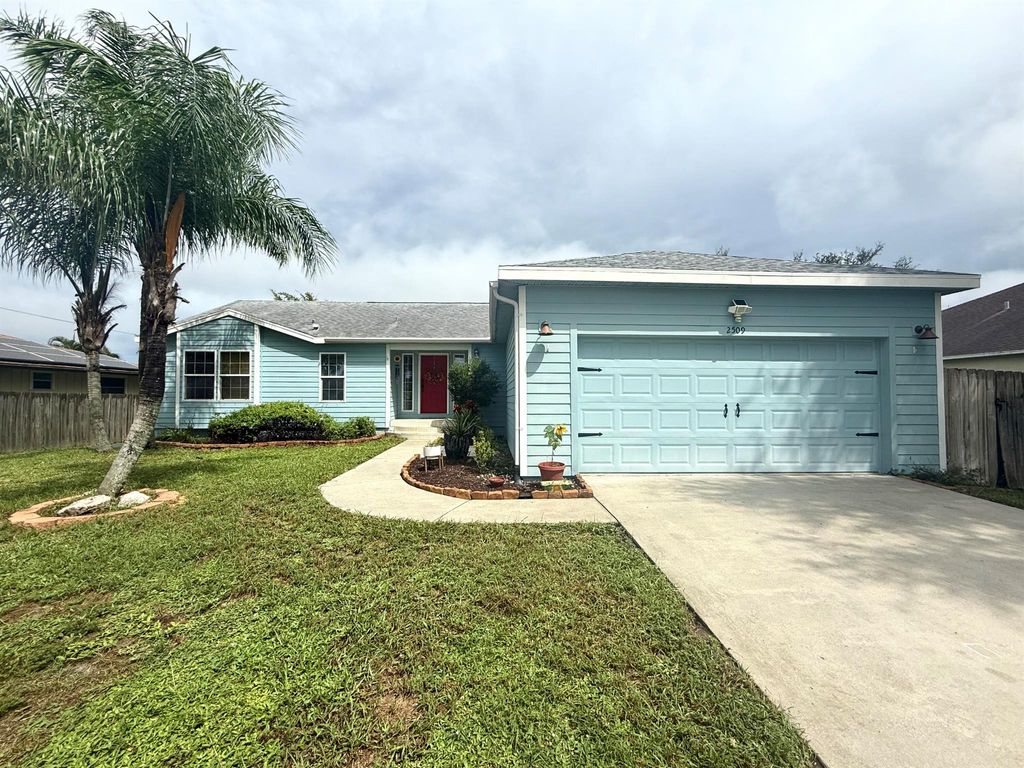 Photo of 2509 SW Cooper Lane, Port Saint Lucie, FL 34984 (MLS # R11127684)