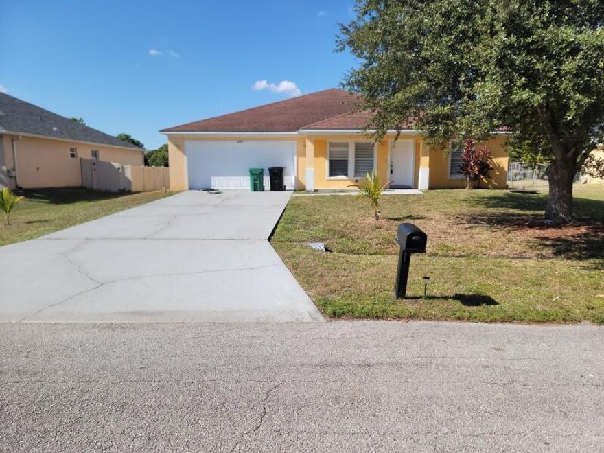 4 Bedroom, 2 Bath, spacious open floor plan with split bedrooms. Hurricane Shutters. Open yard. Two Car Garage and indoor Laundry Room.