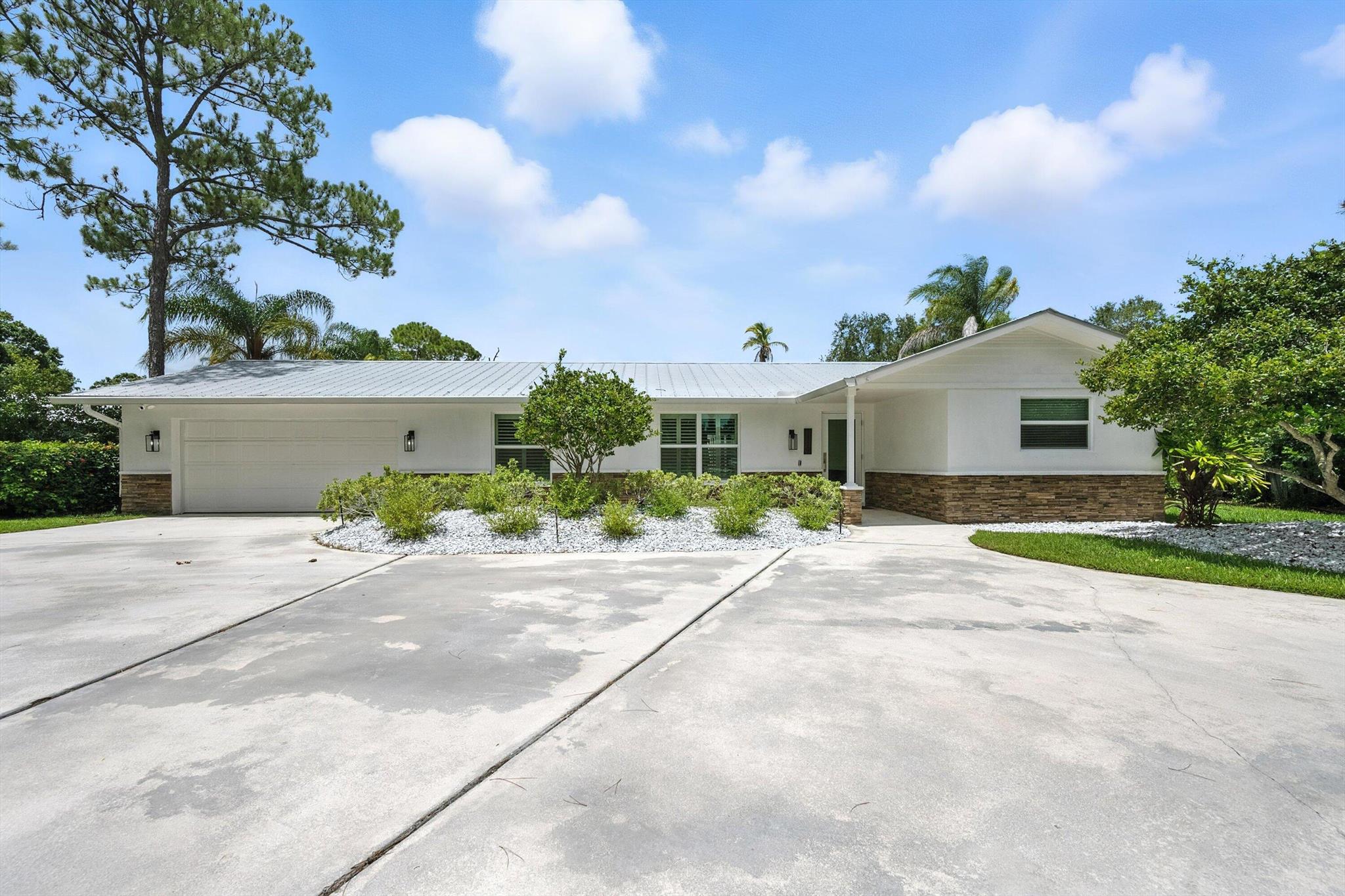 Immediate Availability! Rent this beautifully updated 3-bedroom, 2-bath, CBS pool home on a spacious half-acre lot in the highly sought-after neighborhood North River Shores. This solid, turnkey home boasts all new impact windows and doors, fresh paint, and a stunning interior laundry room (2025) with quartz countertops, tons of cabinetry, and a brand-new washer and dryer. Enjoy the Florida lifestyle with a large POOL and a HUGE private backyard, perfect for relaxing or entertaining. The large circular driveway provides ample parking, bring your boat! North River Shores features 3 private waterfront parks and a community boat ramp with ocean access. NRS is zoned for top-rated schools and located just minutes from beaches, shopping, and dining.