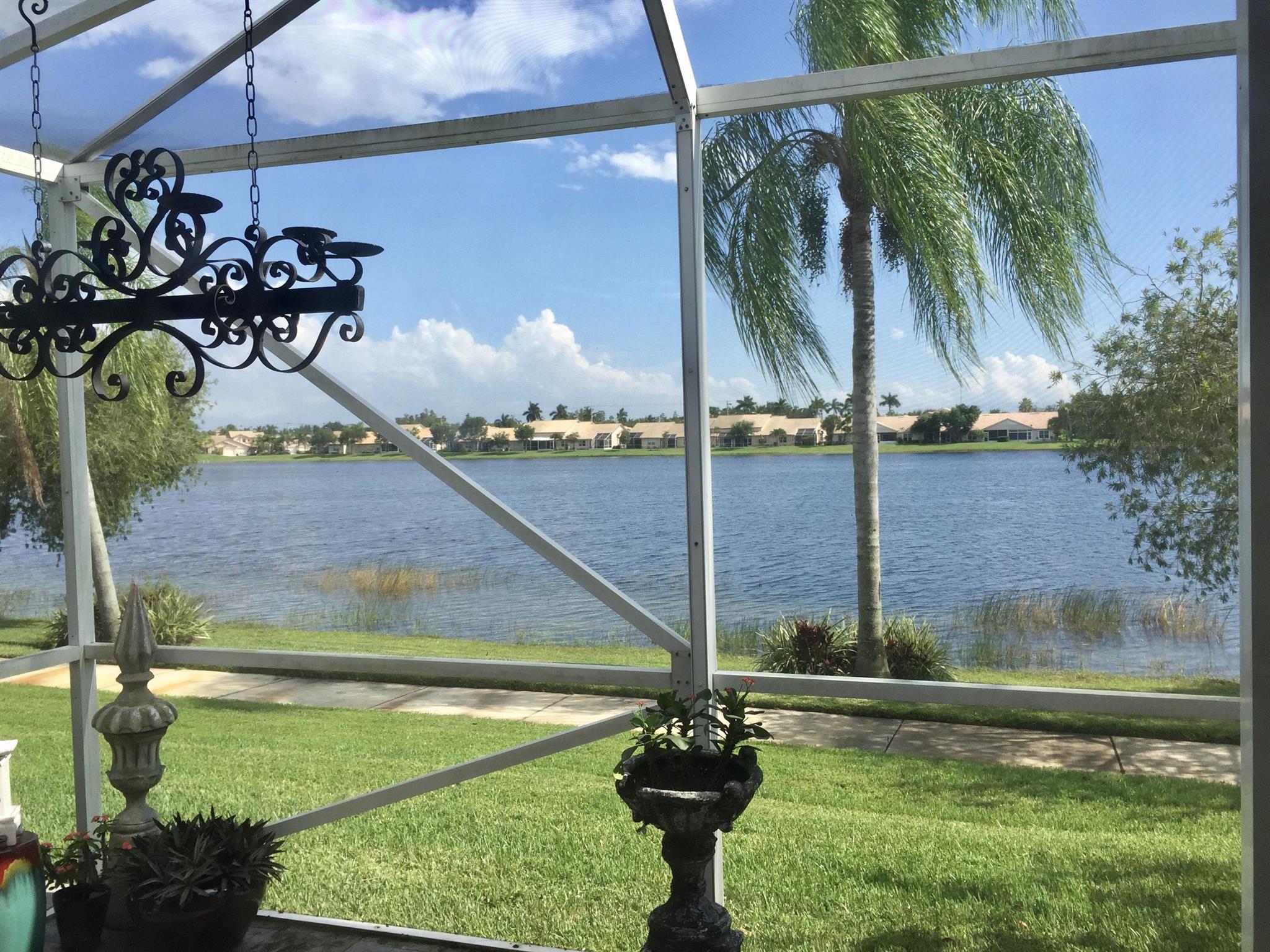 DON'T LET THIS ONE GET AWAY!! GLASS WALLS/FRENCH DOORS ON ENTIRE BACK OF HOME FOR MAX ENJOYMENT OF ''INTRACOASTAL-LIKE'' VIEWS...GORGEOUS!! REMODELED KITCHEN WITH QUARTZ COUNTERTOPS AND NEW SS APPLIANCES. HOME IS COMPLETELY TILED. FEATURES AN ENCLOSED BONUS SUN ROOM, GREAT FOR OFFICE/DEN. CROWN MOULDING, FRENCH DOORS, CUSTOM SKYLIGHTS IN BOTH BATHROOMS, SCREENED PATIO WITH SLATE FLOORING OVERLOOKING LARGE LAKE, 10K IN CUSTOM MADE HUNTER DOUGLAS BLINDS. PERFECTLY PRISTINE! AND CLOSE TO WORLD-CLASS WELLINGTON SHOWGROUNDS! PROUD OWNER SEEKING GREAT TENANTS. SEASONAL POSSIBILITIES.