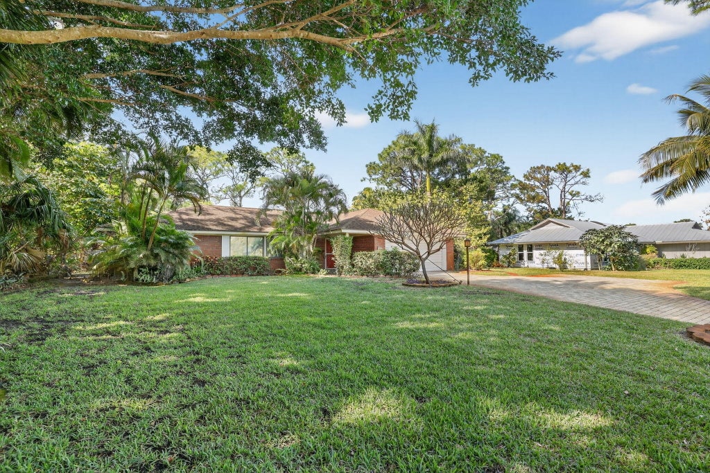 Photo of 1444 NW Spruce Ridge Drive, Stuart, FL 34994 (MLS # R11151153)