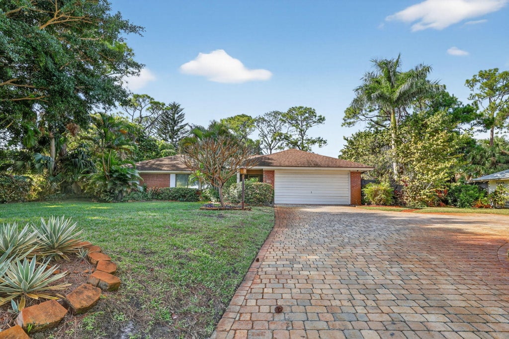 Photo of 1444 NW Spruce Ridge Drive, Stuart, FL 34994 (MLS # R11151153)