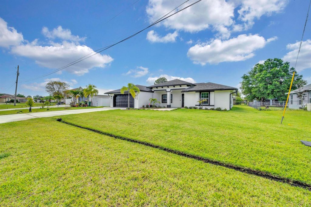 Photo of 5720 NW Alcazar Terrace, Port Saint Lucie, FL 34986 (MLS # R10986056)