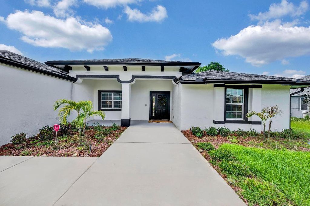 Photo of 5720 NW Alcazar Terrace, Port Saint Lucie, FL 34986 (MLS # R10986056)