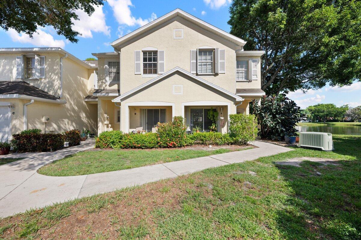 Discover your perfect retreat in this beautifully updated 2 bedroom 2.5 bathroom corner unit townhome boasting 1,648 square feet in the heart of Greenacres! This move-in ready gem offers serene lake views and a prime location, blending modern upgrades and tranquil living. Step inside to a bright and spacious layout, ideal for both entertaining and everyday comfort.Enjoy brand new flooring on the stairway and throughout the upstairs, adding contemporary touch to the bedrooms and hallways. A convenient half bath downstairs enhances functionality for guests. A versatile room upstairs offers the flexibility to be easily converted into a third bedroom, perfect for growing families or a home office.This home is equipped with a new AC installed in 2025 for year round comfort,