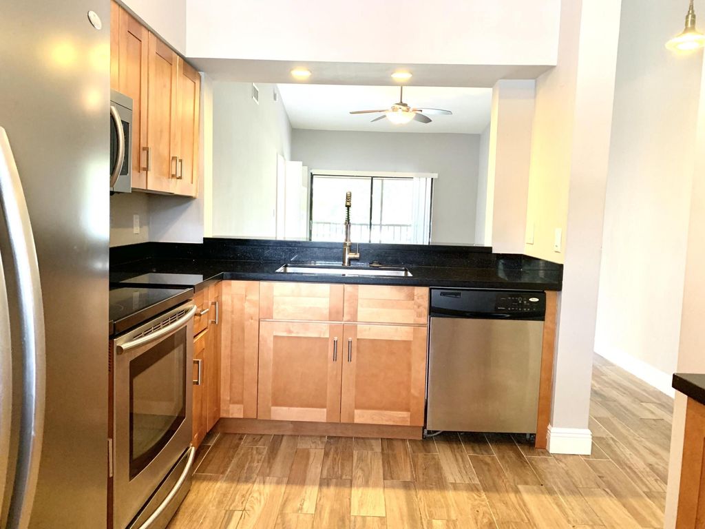 Photo of 2312 S Cypress Bend Drive #209, Pompano Beach, FL 33069 (MLS # B26003144)