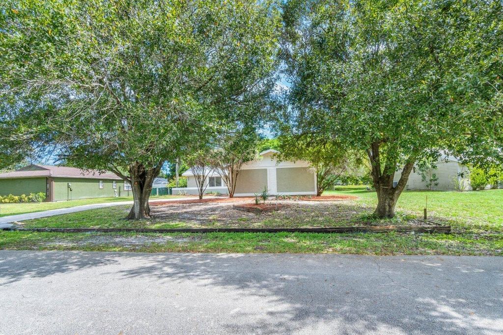 Photo of 207 SW Homeland Road, Port Saint Lucie, FL 34953 (MLS # R10931287)